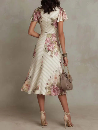Alba | Robe mi-longue portefeuille fleurie et froncée élégante
